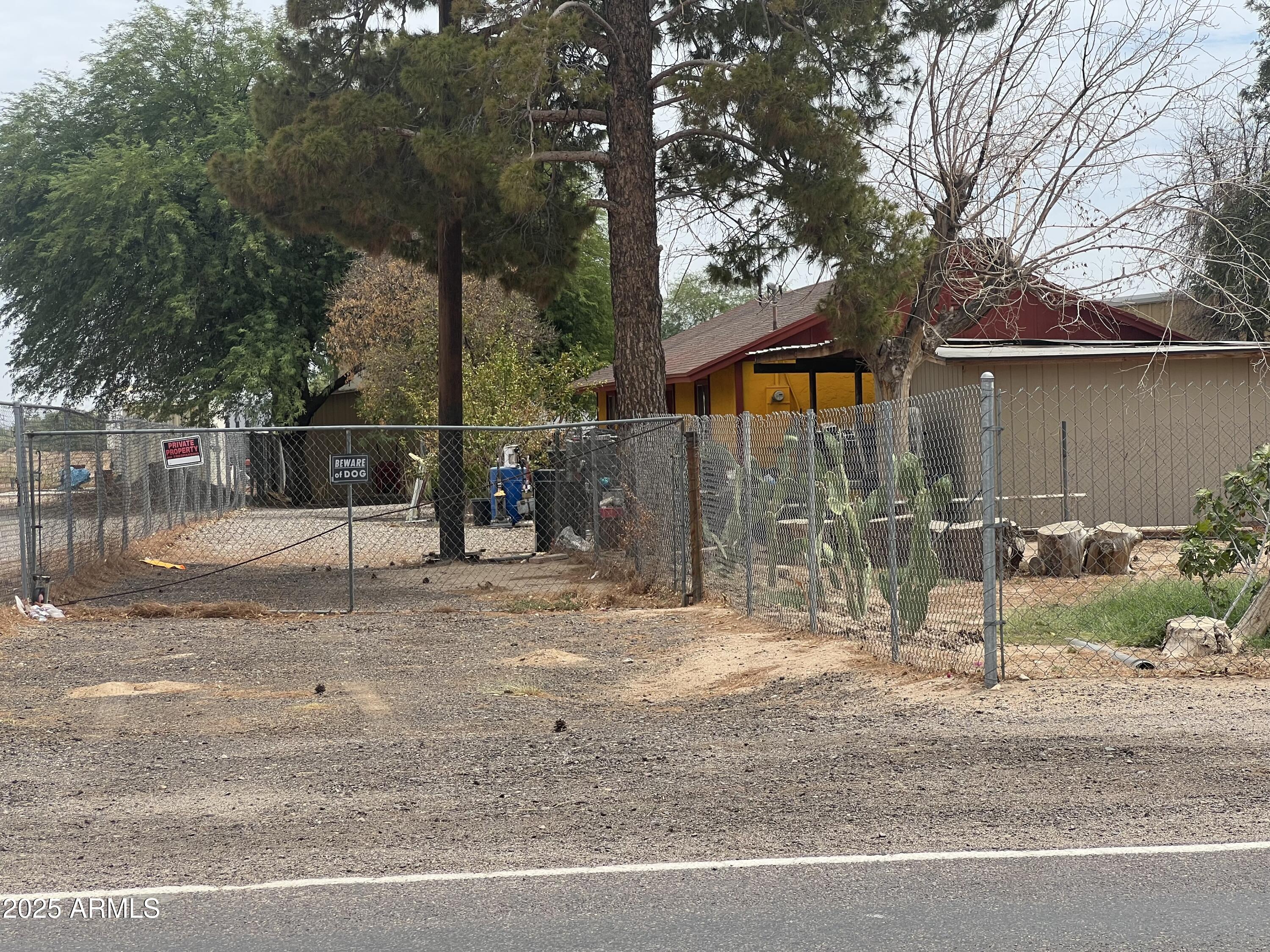 7621 North Alsup Road, Unit REAR Litchfield Park, AZ 85340 - Photo 6 of 26 a backyard of a house with barbeque oven and outdoor seating