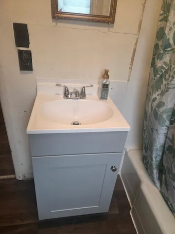 a bathroom with a sink and a mirror