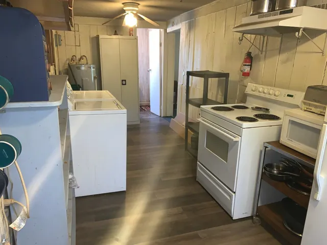 a kitchen with a stove and a refrigerator