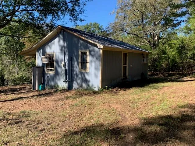 a house with trees in the background