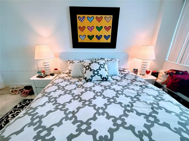 a very nice looking room with a large window and furniture