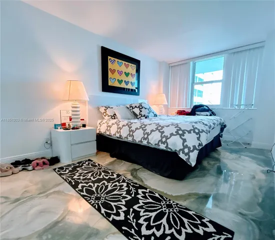 a lobby with a rug and a table