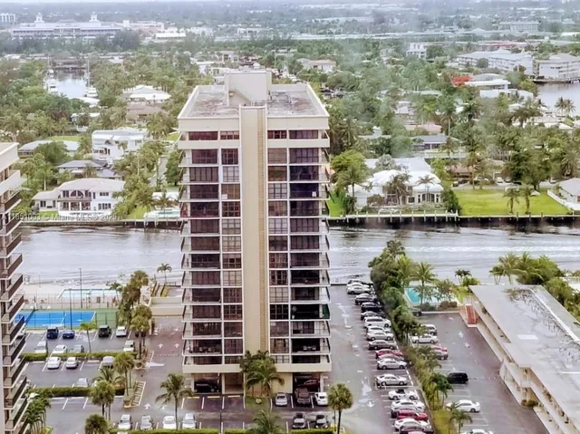 a kitchen with stainless steel appliances granite countertop a sink a stove and a microwave