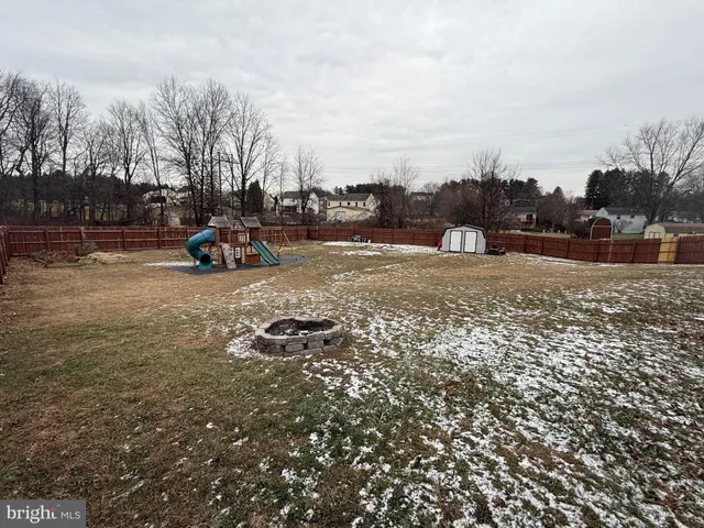a view of a yard with cars