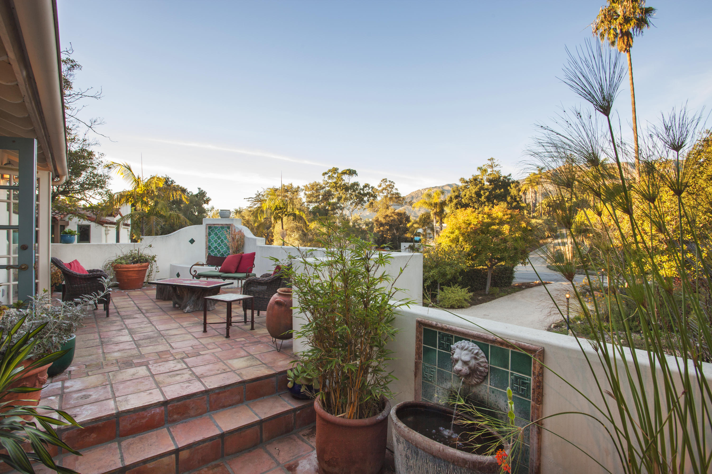 2141 Mission Ridge Road Santa Barbara, CA 93103 - Photo 13 of 18 a view of a patio with table and chairs and potted plants