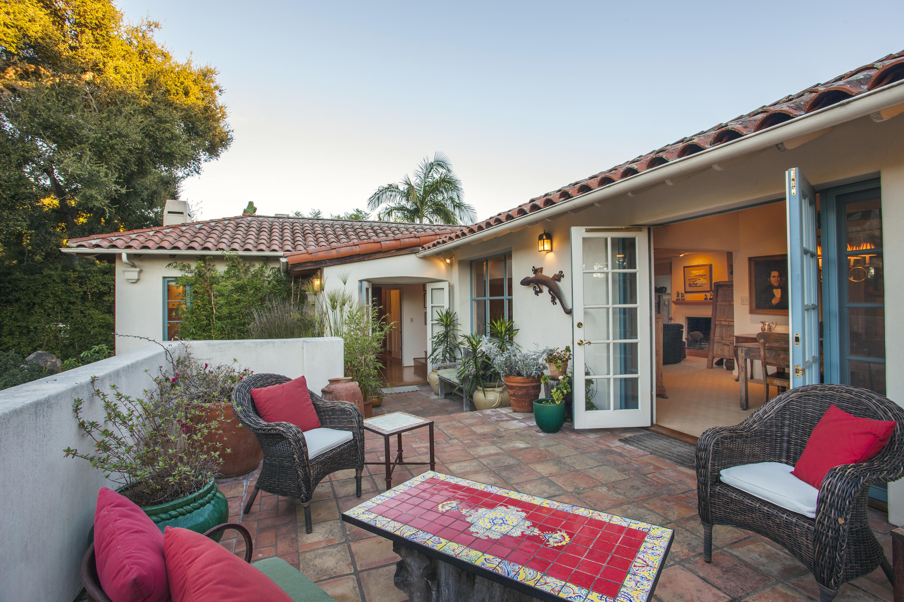 2141 Mission Ridge Road Santa Barbara, CA 93103 - Photo 16 of 18 a patio with couches table and chairs and potted plants