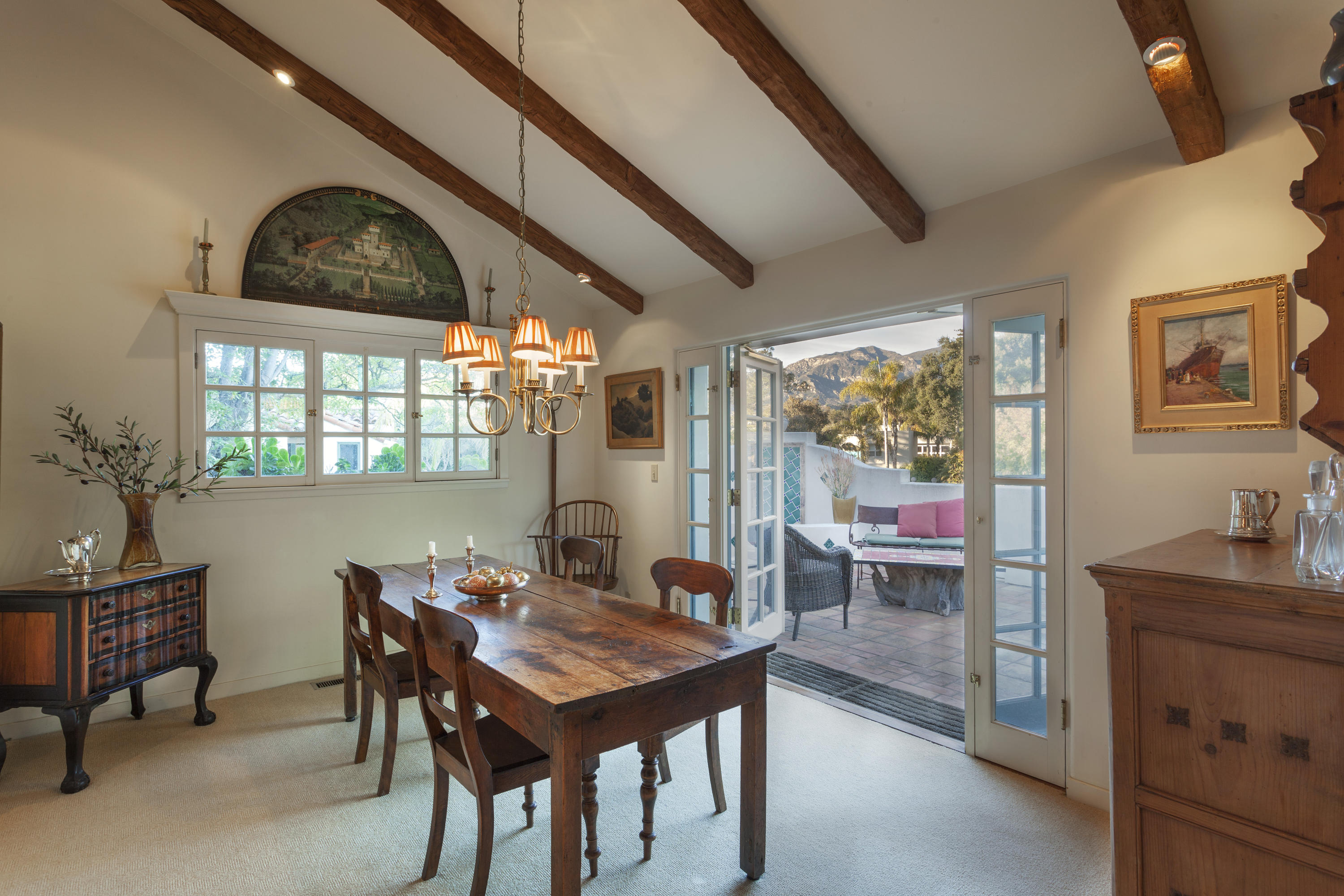 2141 Mission Ridge Road Santa Barbara, CA 93103 - Photo 6 of 18 a dining room with a wooden table and chairs
