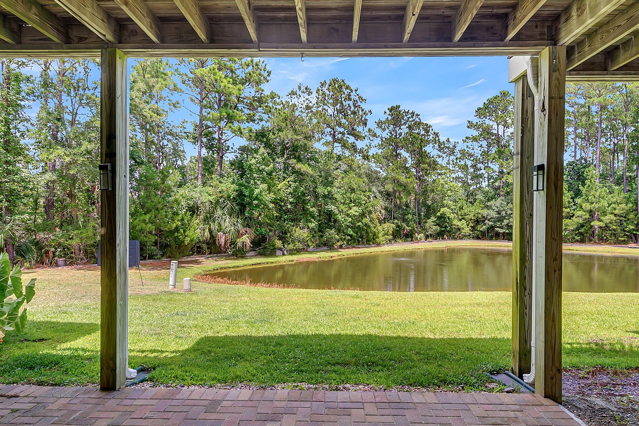 176 Fair Sailing Road Mount Pleasant, SC 29466 - Photo 7 of 56 Covered patio overlooking pond