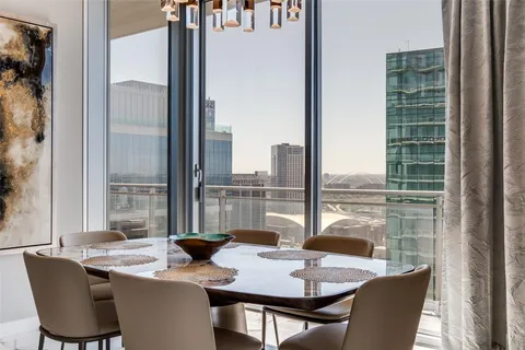 a view of a dining room with furniture window and outside view