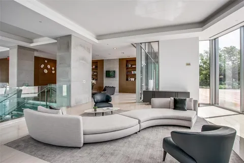 a living room with furniture and large window