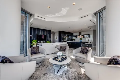 a living room with furniture and a rug