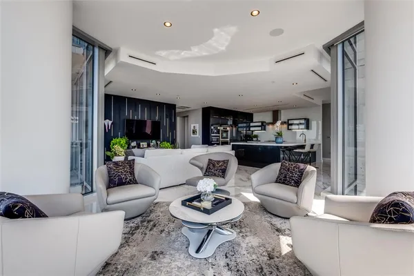 a living room with furniture and a rug