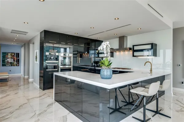 a kitchen with a table and chairs in it