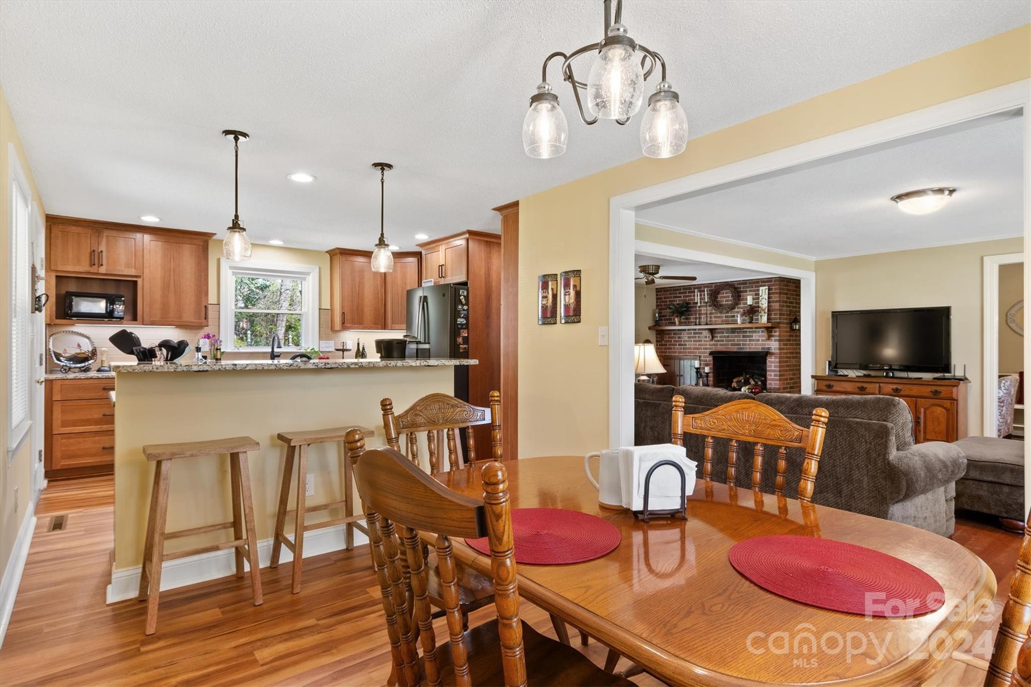 215 6th Street Northeast Conover, NC 28613 - Photo 17 of 47 a dining room filled chandelier and wooden floor