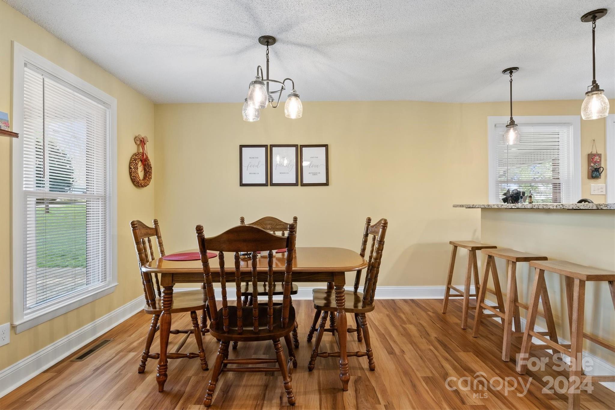 215 6th Street Northeast Conover, NC 28613 - Photo 18 of 47 a view of a dining room with furniture wooden floor and chandelier