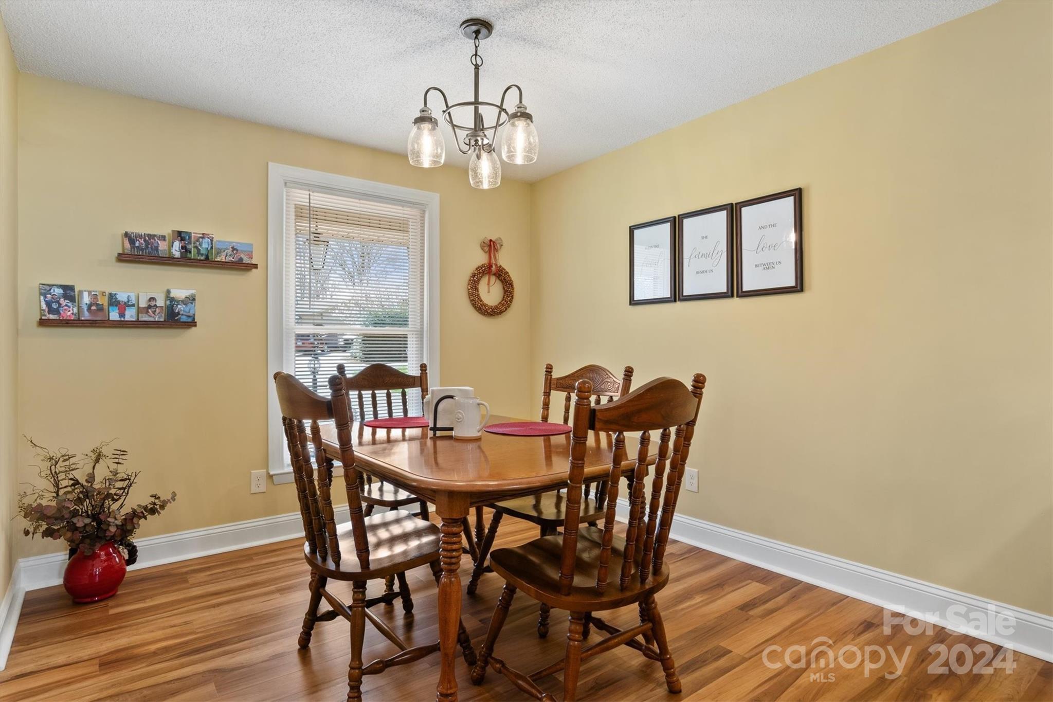 215 6th Street Northeast Conover, NC 28613 - Photo 19 of 47 a view of a dining room with furniture and wooden floor