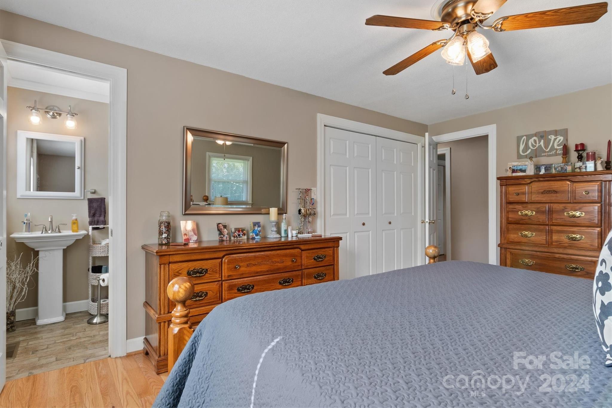 215 6th Street Northeast Conover, NC 28613 - Photo 22 of 47 a bedroom with a bed and a dresser
