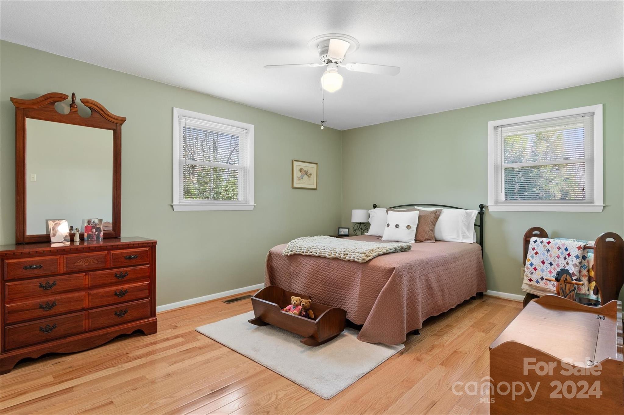 215 6th Street Northeast Conover, NC 28613 - Photo 25 of 47 a bedroom with a bed and wooden floor