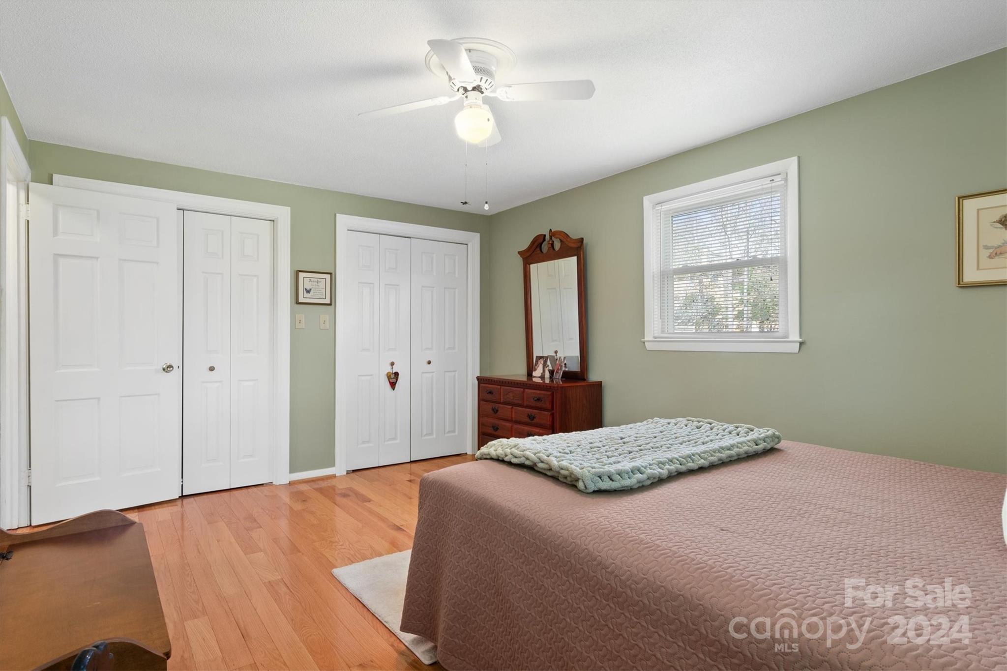 215 6th Street Northeast Conover, NC 28613 - Photo 26 of 47 a bedroom with a large bed and a chandelier
