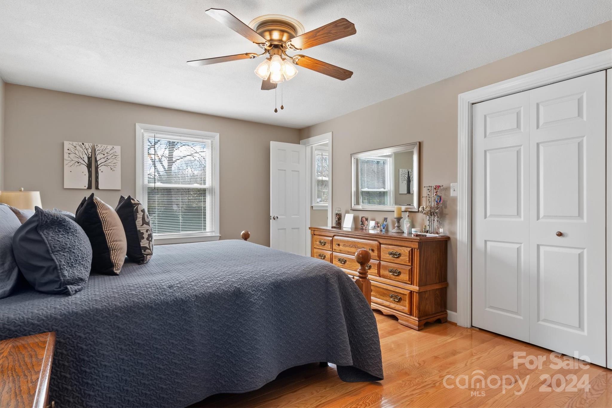 215 6th Street Northeast Conover, NC 28613 - Photo 30 of 47 a bedroom with a large bed a chandelier and dresser