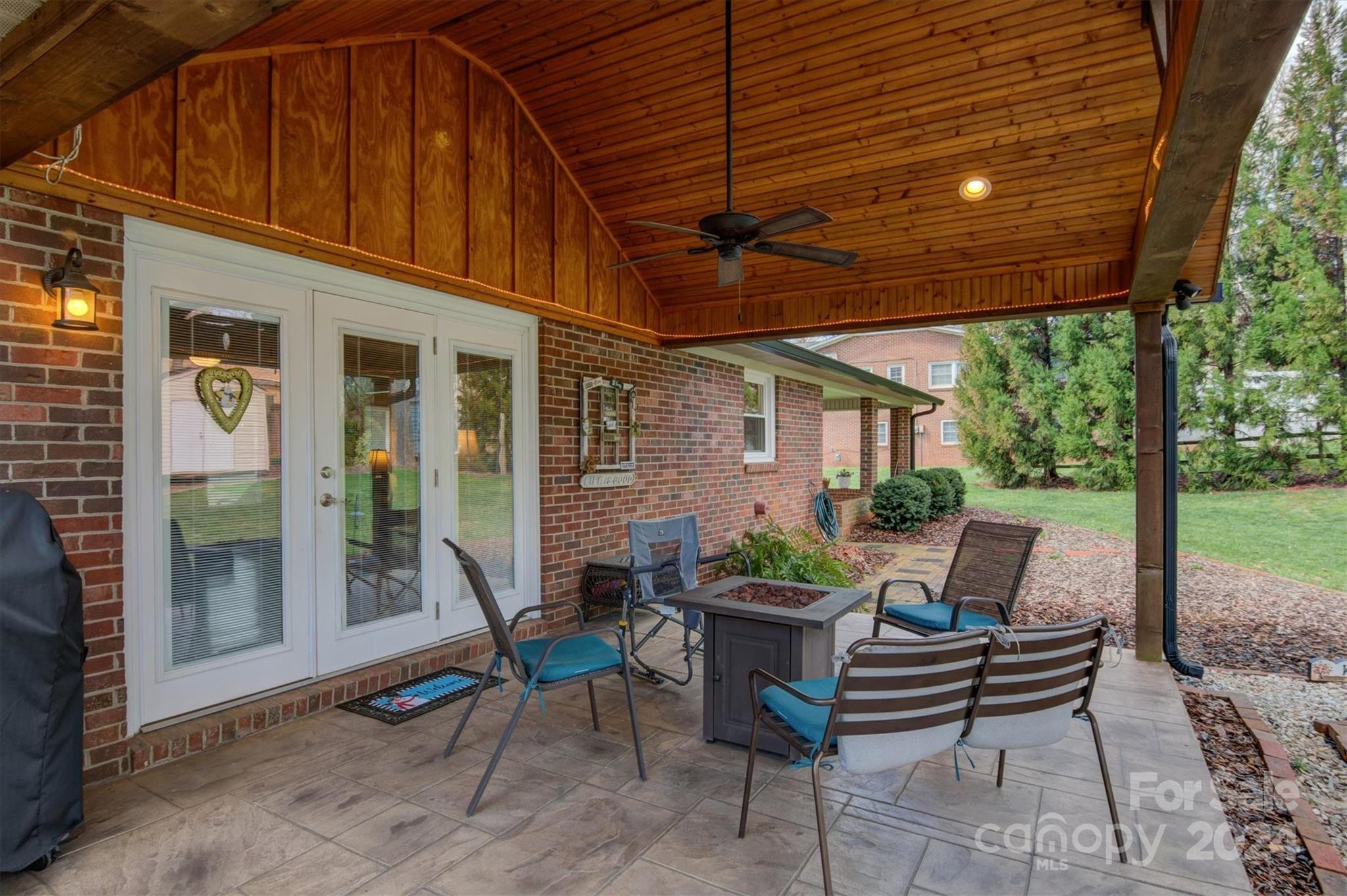 215 6th Street Northeast Conover, NC 28613 - Photo 37 of 47 a view of patio with a table and chairs under an umbrella