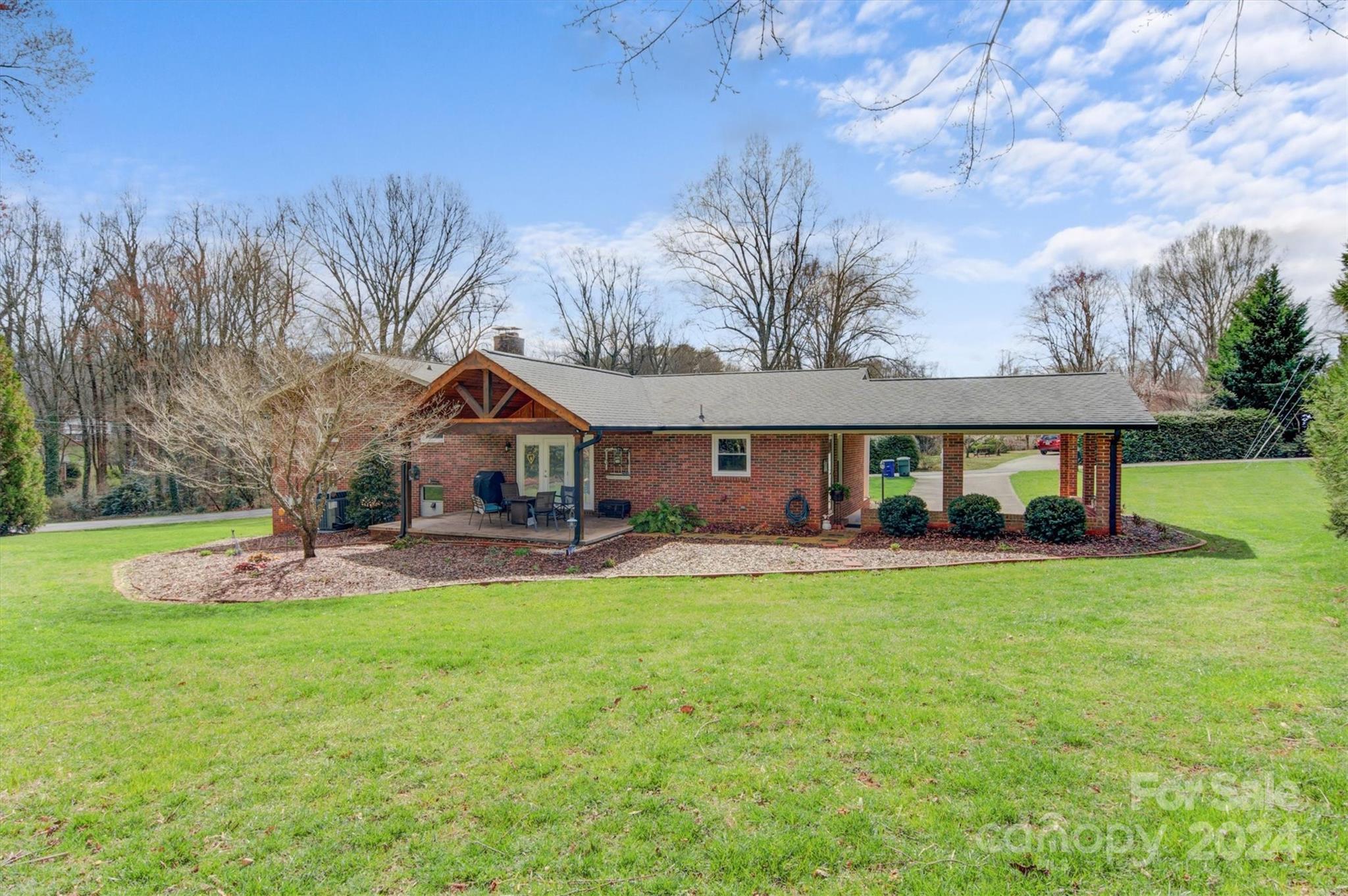 215 6th Street Northeast Conover, NC 28613 - Photo 39 of 47 a front view of a house with a yard and porch