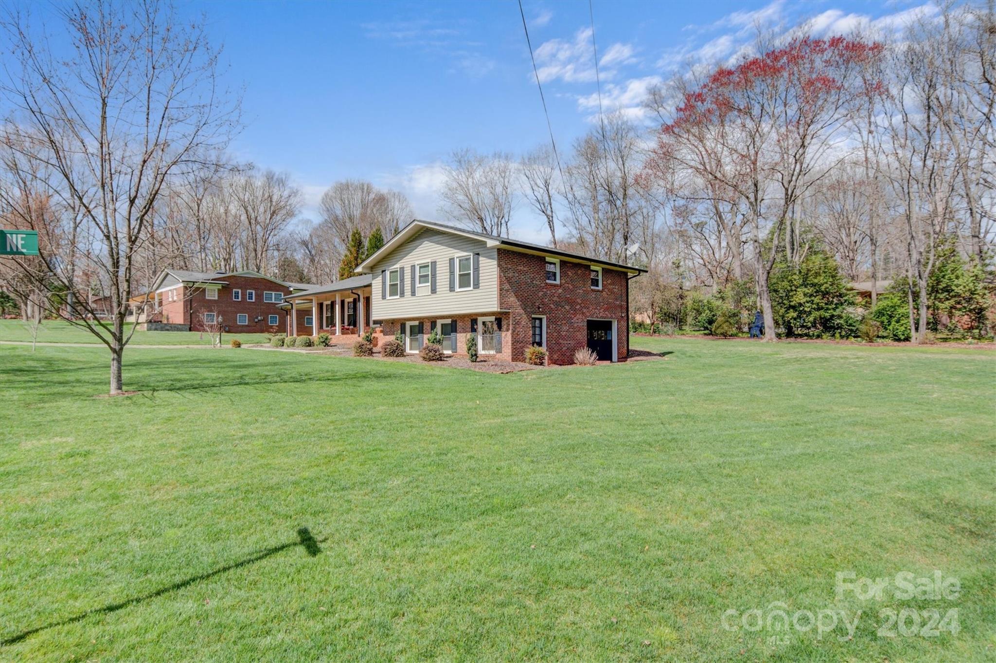 215 6th Street Northeast Conover, NC 28613 - Photo 42 of 47 a view of a house with a big yard and large trees