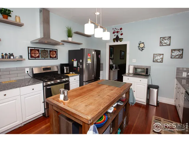 a kitchen with a table and chairs in it
