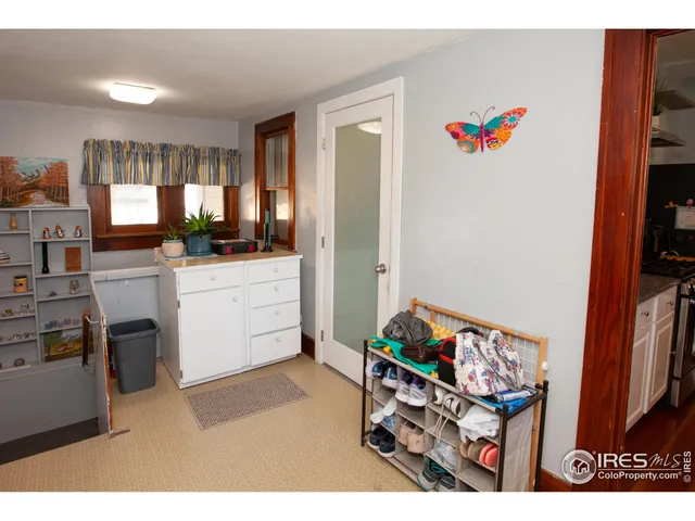 a kitchen that has a lot of cabinets a sink and a stove in it