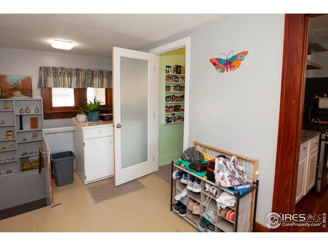 a kitchen that has a lot of cabinets a sink and a stove in it