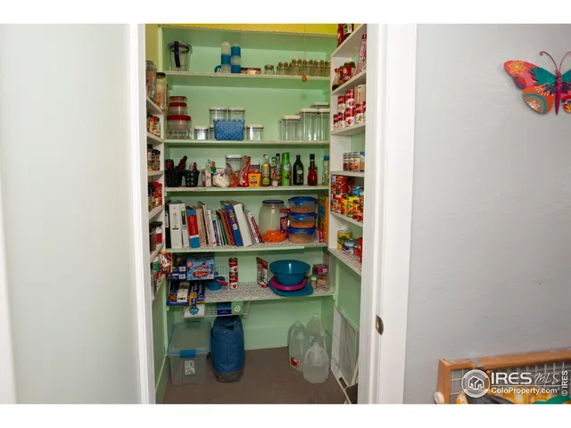 a shelf with books and knick knacks on it