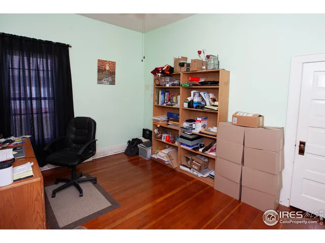 a room with furniture and a book shelf