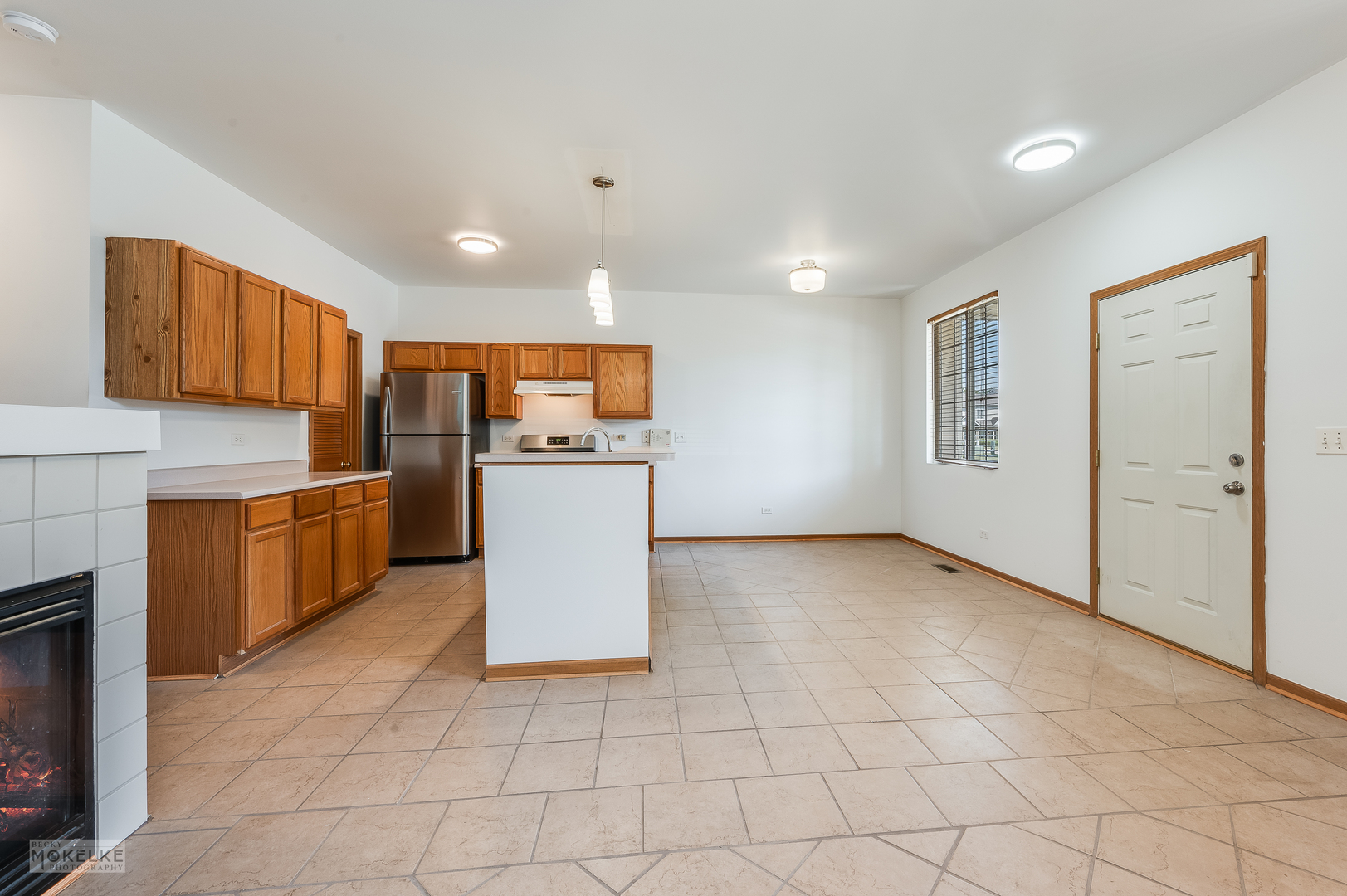 123 Yarrow Court Romeoville, IL 60446 - Photo 8 of 21 a kitchen with a refrigerator and a stove top oven