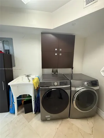 a utility room with dryer and washer