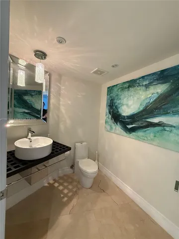 a bedroom with a bed and a television