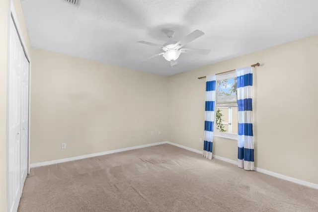 an empty room with shelves