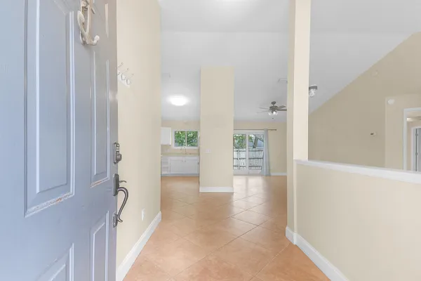 a view of an entryway with wooden floor