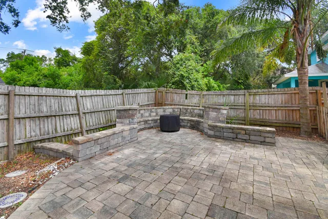 a view of a backyard with a small cabin and a chair