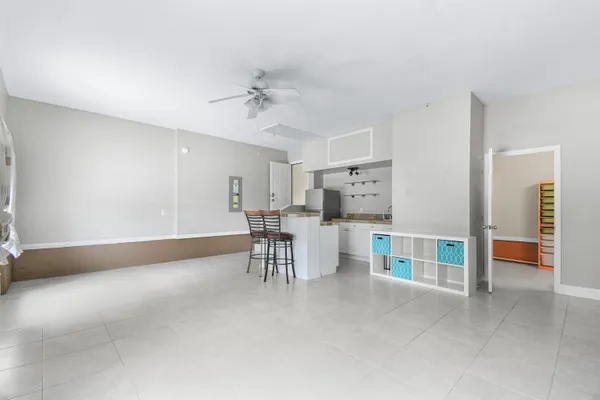 a view of a livingroom with furniture and a table in a room