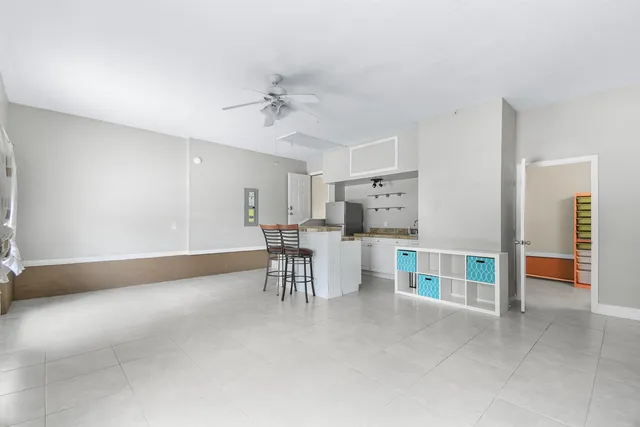 a view of a livingroom with furniture and a table in a room