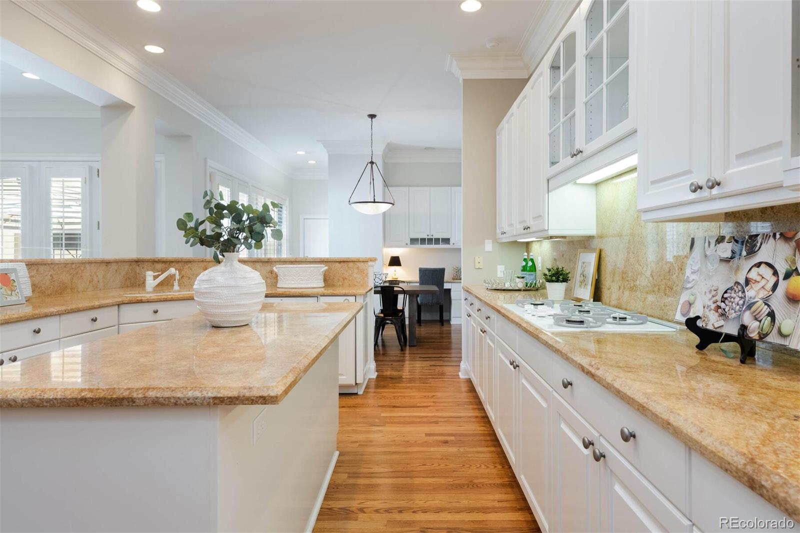 470 Monroe Street Denver, CO 80206 - Photo 11 of 40 a large kitchen with kitchen island lots of counter space a sink and appliances