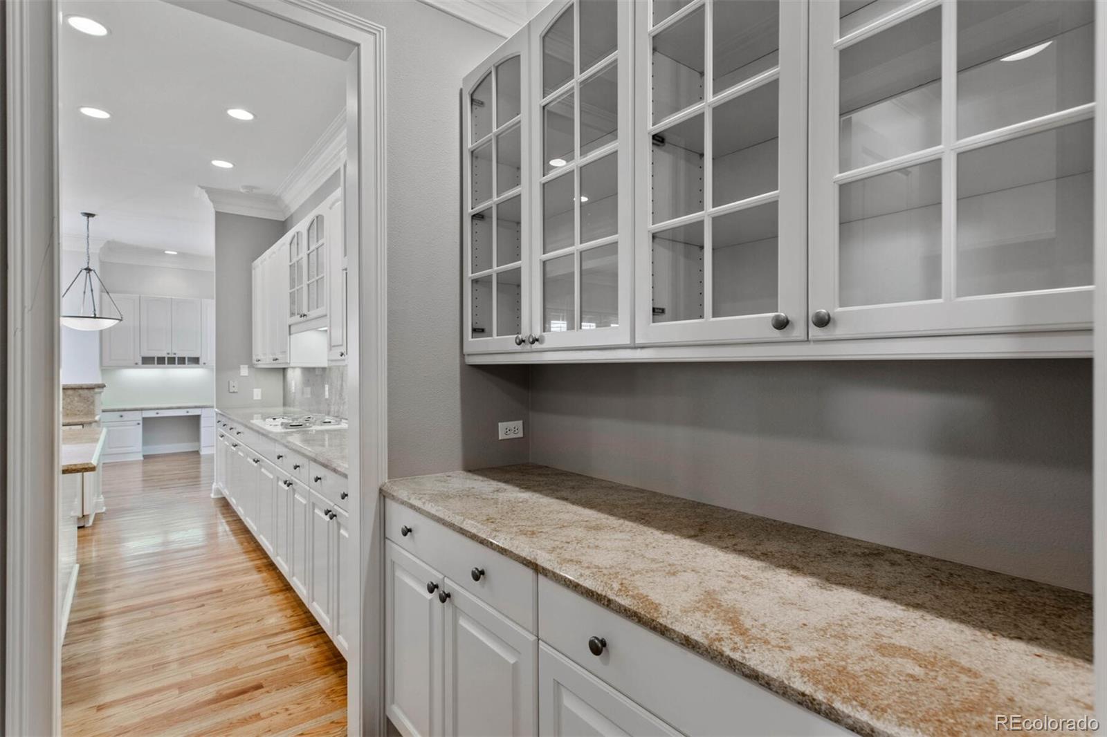 470 Monroe Street Denver, CO 80206 - Photo 13 of 40 a open kitchen with granite countertop white cabinets and stainless steel appliances