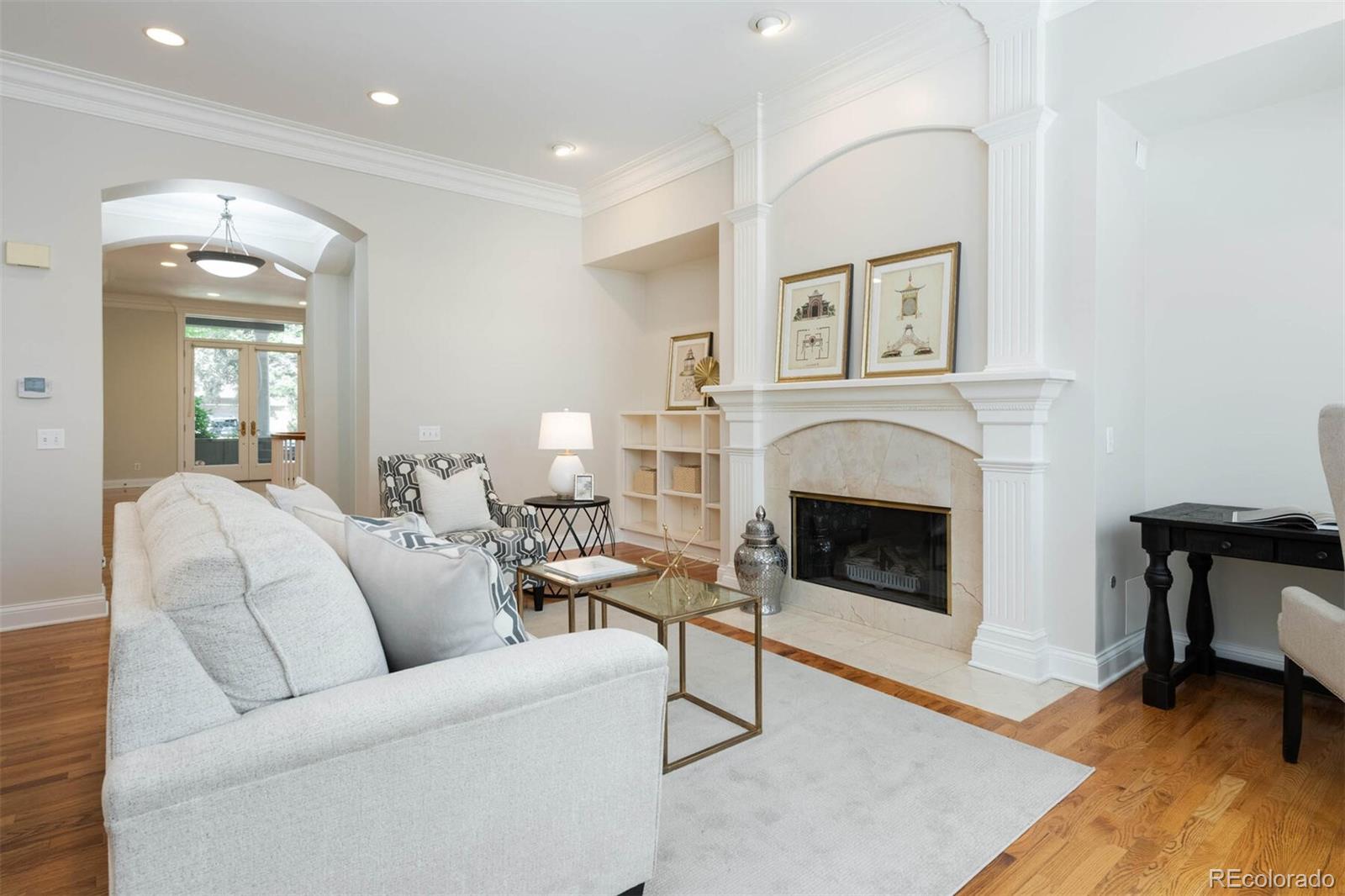 470 Monroe Street Denver, CO 80206 - Photo 14 of 40 a living room with furniture a fireplace and a table