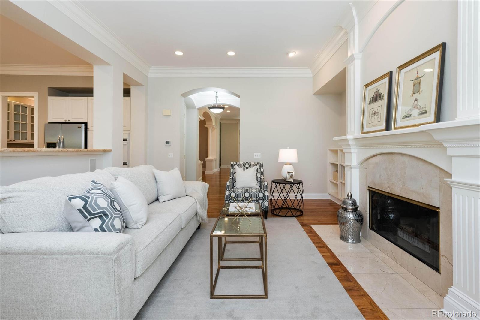 470 Monroe Street Denver, CO 80206 - Photo 15 of 40 a living room with furniture and a fireplace