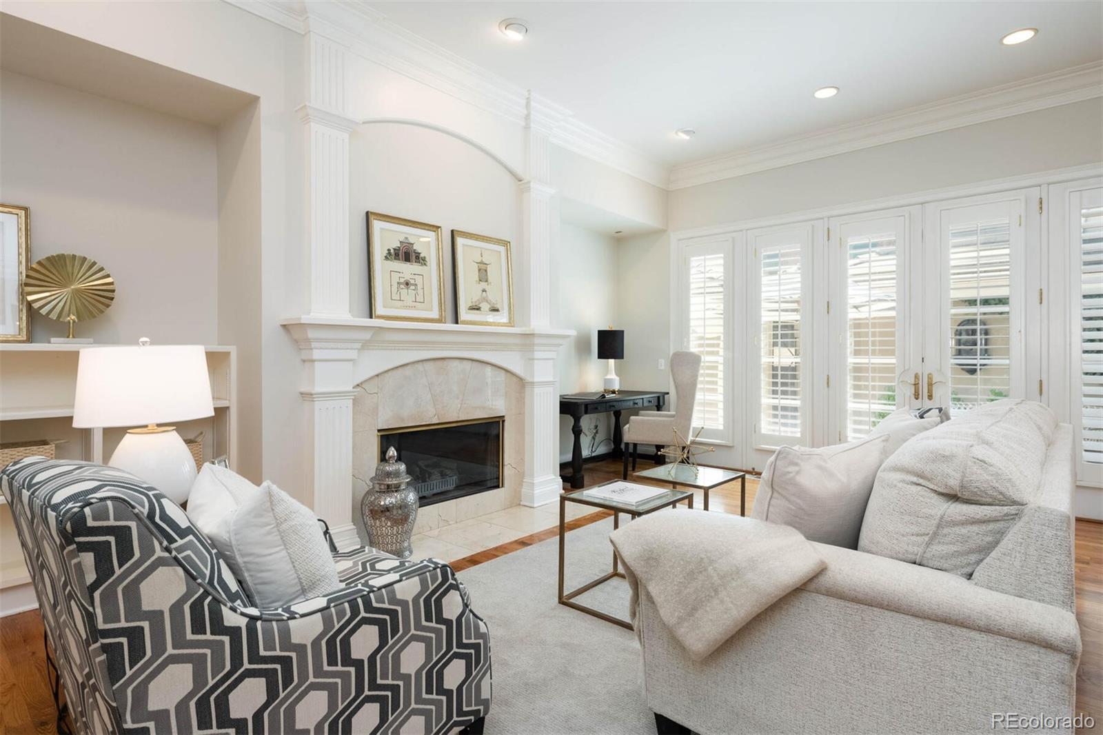 470 Monroe Street Denver, CO 80206 - Photo 16 of 40 a living room with furniture large window and a fireplace
