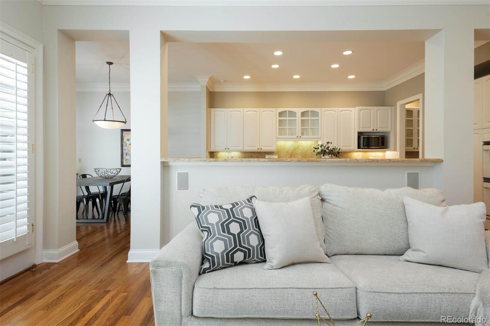 470 Monroe Street Denver, CO 80206 - Photo 17 of 40 a living room with furniture and a wooden floor