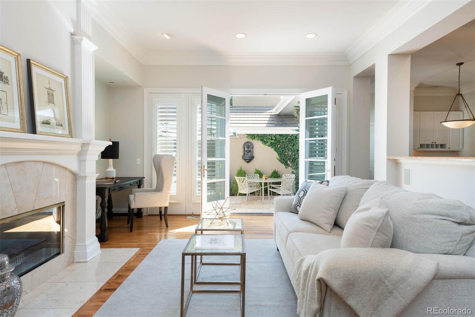 470 Monroe Street Denver, CO 80206 - Photo 18 of 40 a living room with furniture and a fireplace