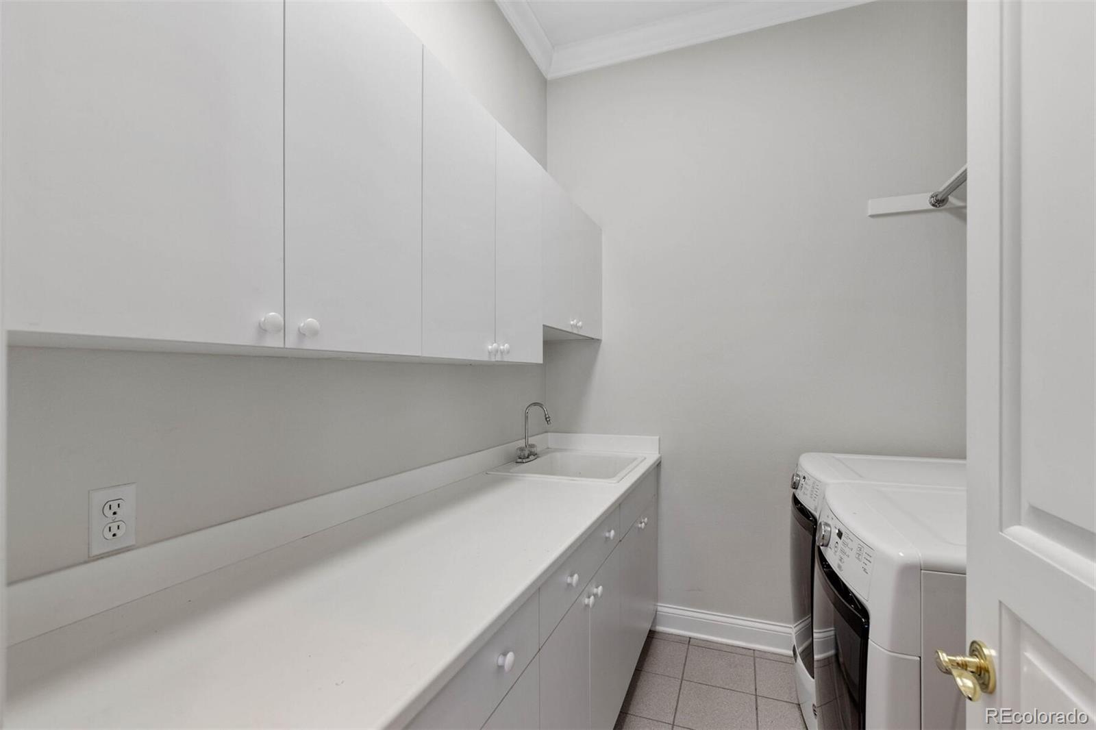 470 Monroe Street Denver, CO 80206 - Photo 21 of 40 a utility room with a sink