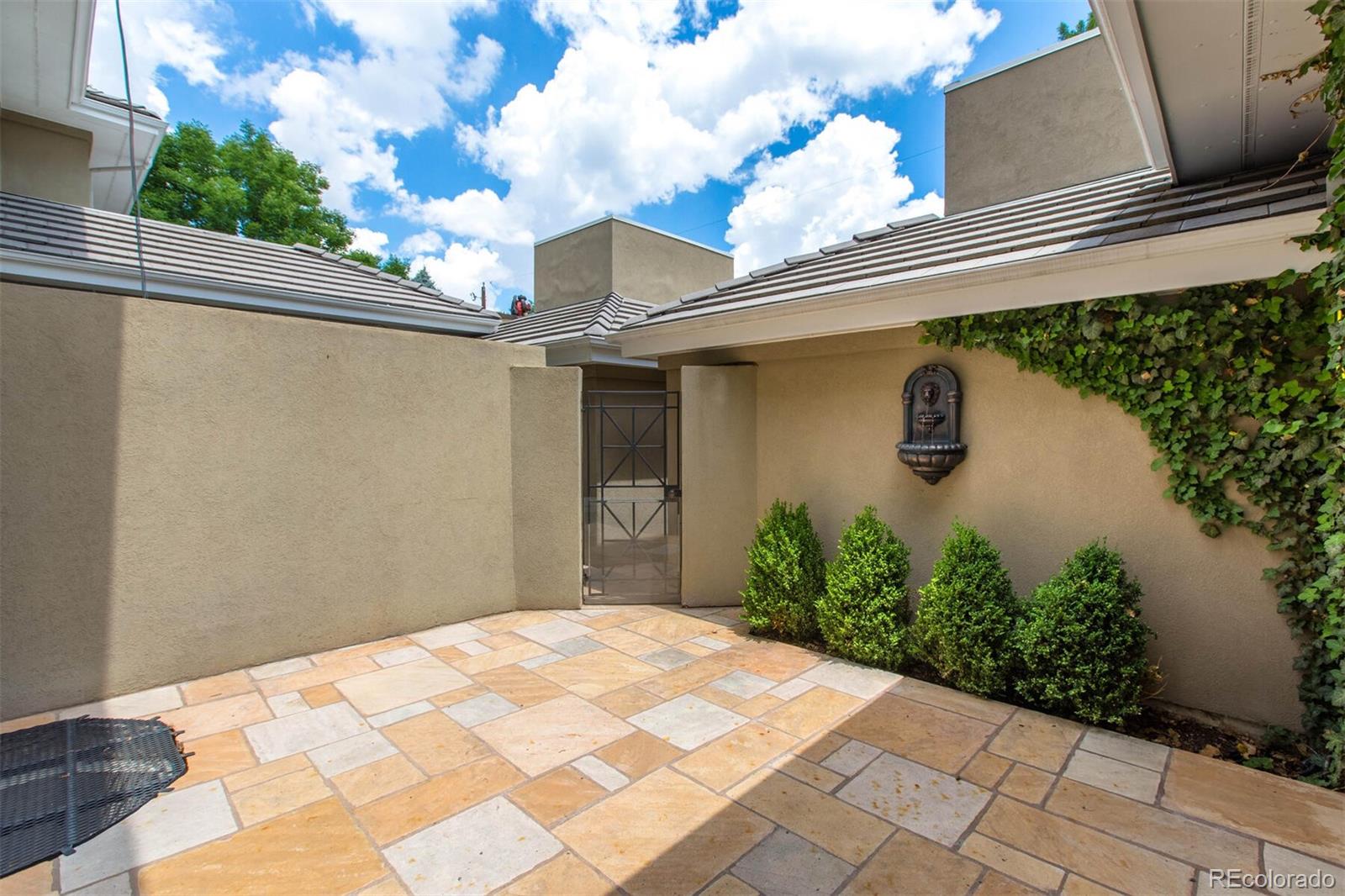 470 Monroe Street Denver, CO 80206 - Photo 22 of 40 a front view of a house with garden