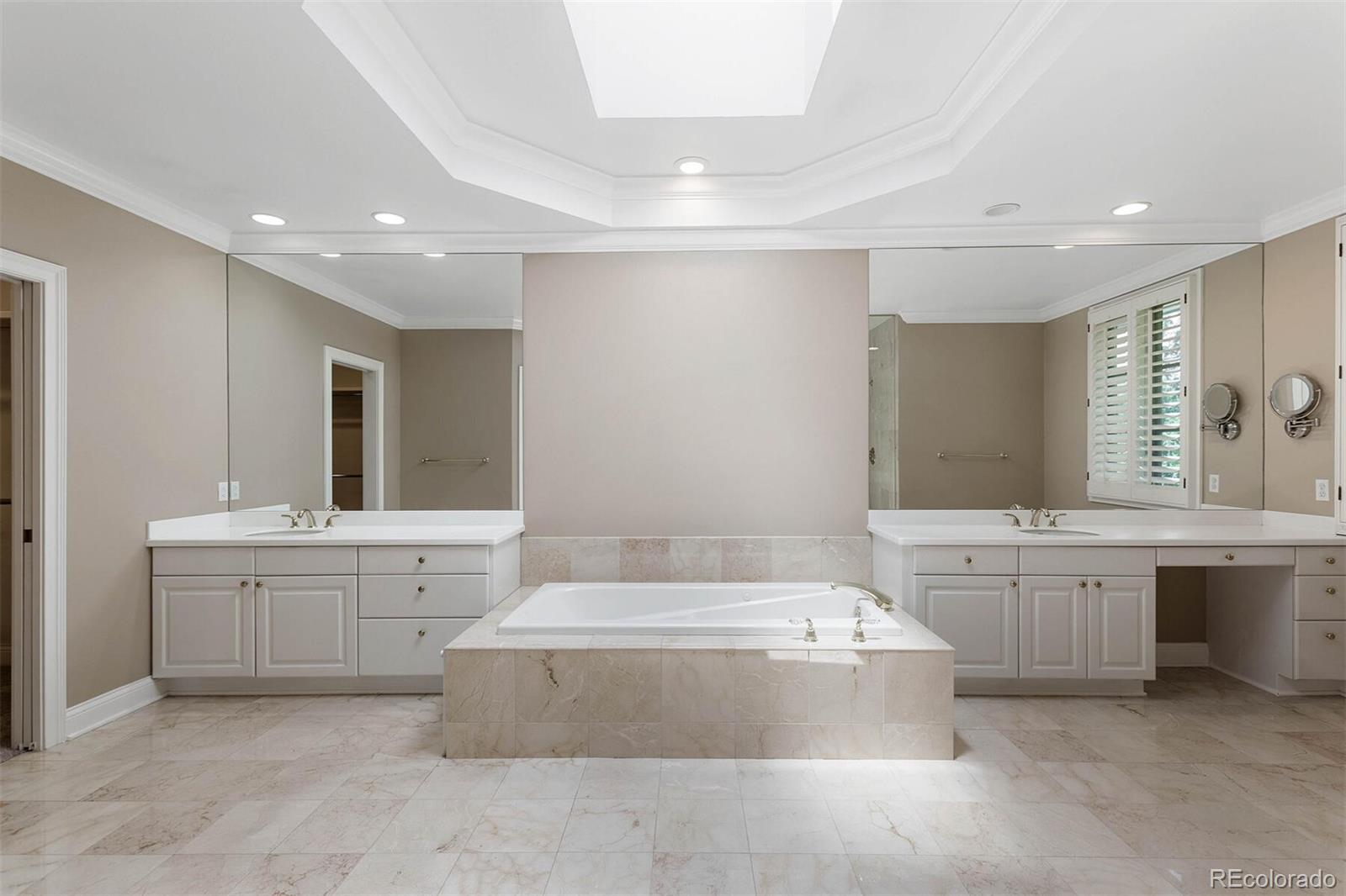 470 Monroe Street Denver, CO 80206 - Photo 27 of 40 a bathroom with a tub sink and mirror